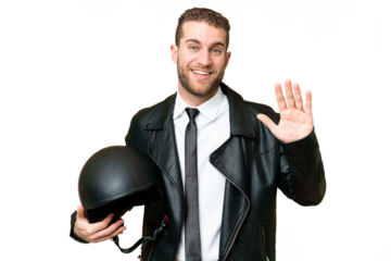Business man with a motorcycle helmet over isolated chroma key background saluting with hand with happy expression