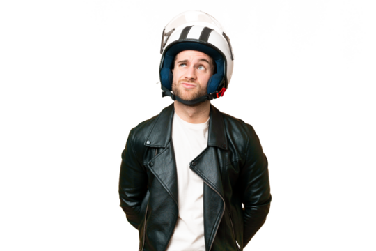 Young handsome blonde man with a motorcycle helmet over isolated chroma key background and looking up
