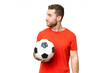 Handsome young football player man over isolated chroma key background looking to the side