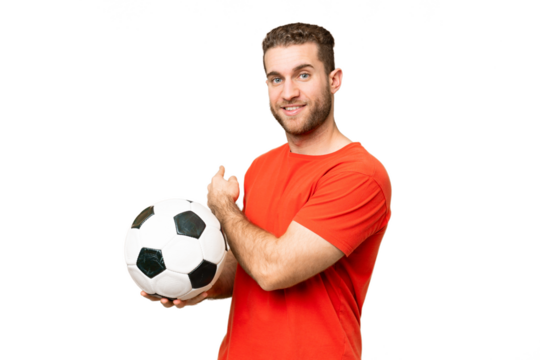Handsome young football player man over isolated chroma key background pointing back