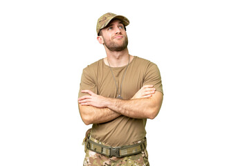 Military with dog tag over isolated chroma key background making doubts gesture while lifting the shoulders