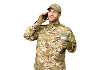 Military man over isolated chroma key background holding coffee to take away and a mobile
