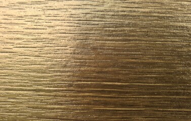 Golden wood plank photo, slightly blurred image for product placement as background illustration.