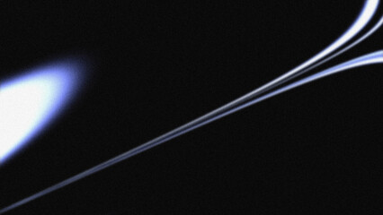 Abstract light streaks on a dark, grainy background