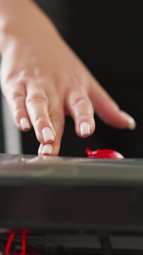 Lady commences treadmill by activating start button closeup. Woman sets speed of gym apparatus for indoor fitness sessions. Technology in sports equipment