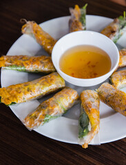Vietnamese Banh Xeo crepes wrapped in rice paper