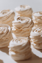 Soft vanilla marshmallow dessert in natural light with airy texture and spiral shape