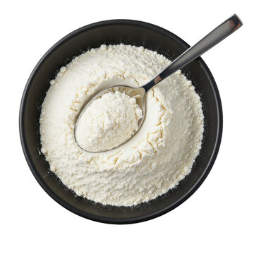 Matte black ceramic bowl with white flour, polished silver tablespoon on rim, transparent background, flat lay, diffused studio light. Culinary purity concept.