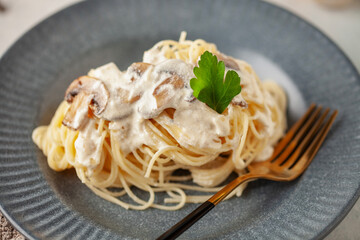 Spaghetti pasta with mushroom white cream sauce.  Italian food style