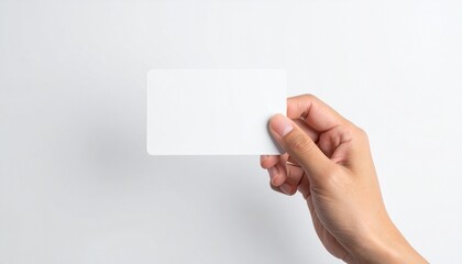 Hand holding an empty white plastic card. This template is ideal for business, credit, or gift card mockups on an isolated background