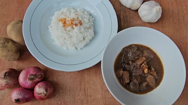 cocoa powder and cinnamon,Semur daging is an Indonesian meat stew in thick brown gravy,served with steamed rice