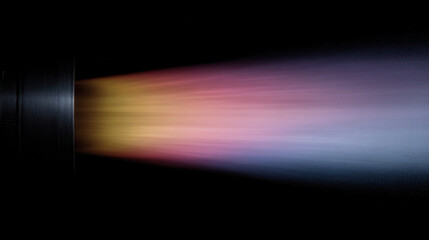 Colorful rocket exhaust with rainbow hues against black background