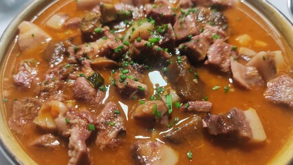 pig tryp dish as typical spanish tapas food with chickpeas