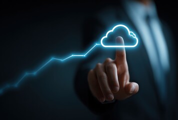 Hand in suit pointing towards a luminous cloud symbol connected to an ascending line, illustrating digital growth against a dark background