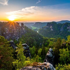 Fototapeta premium Sunrise over a valley with rock formations