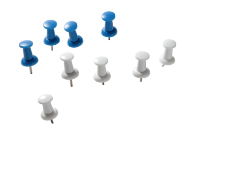 Assorted blue and white pushpins scattered