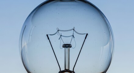 Close-up of transparent light bulb against clear sky
