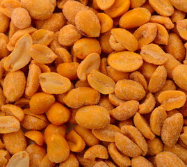 Salted roasted peanuts close up background
