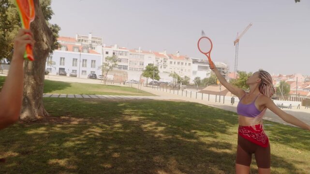 Engaging in Fun Outdoor Play Activities with Friends Using Bright and Colorful Frisbies