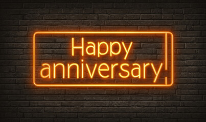 Glowing Neon Happy Anniversary Sign on Brick Wall.