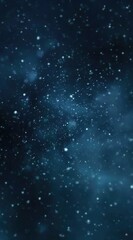 Obraz premium A blurred, dark blue cosmic background featuring soft, diffused light points resembling stars or particles, evoking a sense of vastness and mystery