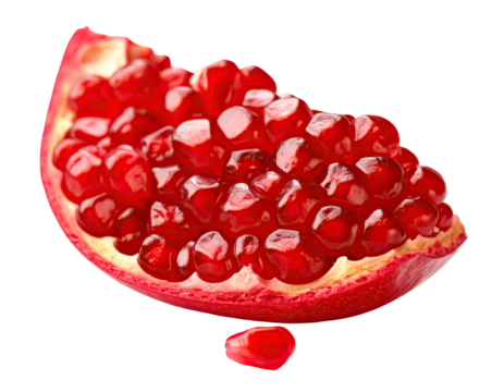 Close-up of a pomegranate slice, vibrant red seeds filling the fruit