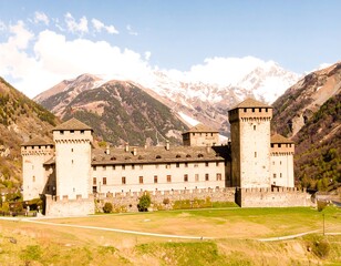 Fototapeta premium Ancient castle nestled in alpine valley