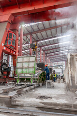 Manufacturing plant with heavy machinery for concrete tunnels covers. Machine, concrete, factory, warehouse, construction, site, environment, engineering, teamwork, workplace