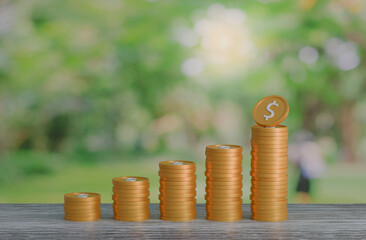 gold coin stacking 3D render on wodden board with photo of green blur nature background for business concept financial, banking and investment with money growth success.