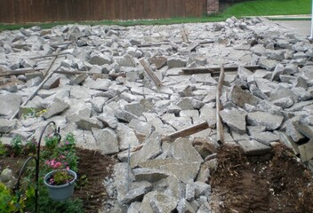 Broken concrete of old driveway in preparation for replacement