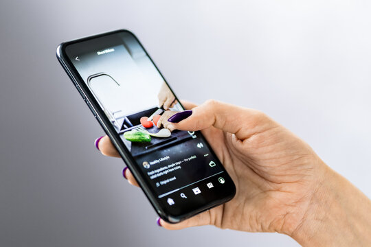 Video on social media. Reel short content. Teenager scrolling or woman watching phone. Sponsored clip in smartphone. Marketing ad on mockup platform.