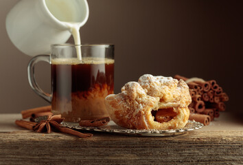 Viennese strudel and coffee on an old wooden table.