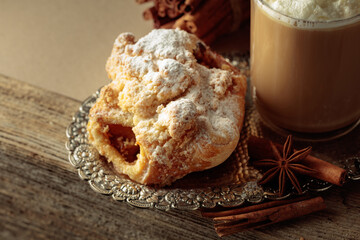 Vienna strudel and caffe latte on a silver tray.