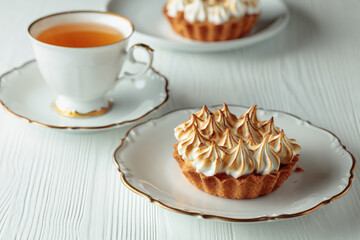 Meringue tart on a white table.