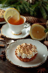 Meringue lemon tart and cup of tea.