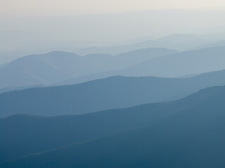 Fototapeta premium Hazy mountain ranges at dawn