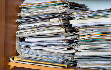 Randomly folded paper and price lists as waste paper.