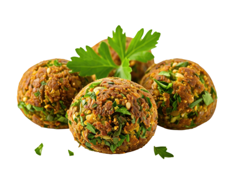 Three falafel balls, golden-brown, speckled with greens, nestled together, topped with fresh parsley, on a white surface