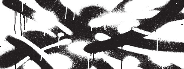 Black and white spray paint splatter forming urban art and graffiti inspired abstract pattern