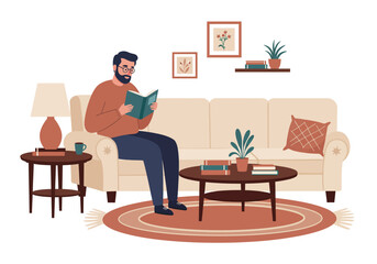 Man with Beard and Glasses Reading a Book on a Beige Sofa in Living Room