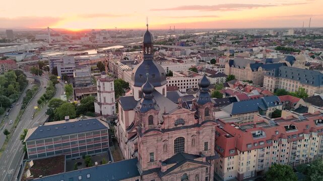 Aerial drone footage of Mannheim and Christuskirche on summer evening, showcasing German architecture. Mannheim, Germany