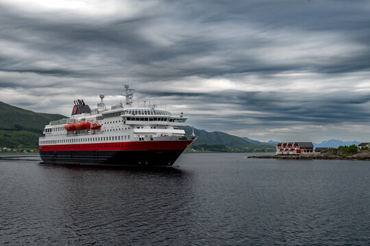 Big Cruise Ship And Ferry Arrives In The Harbor Of Stokmarknes At The Lofoten In Norway