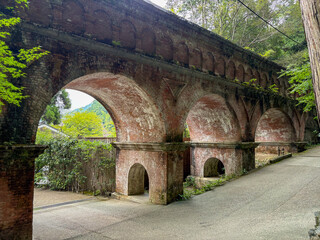 Suirokaku Aqueduct with Red Brick Arches and Greenery in Kyoto, Japan