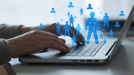 Hands typing on a laptop with a network of connected human figures overlaying the screen, symbolizing digital connectivity and teamwork.