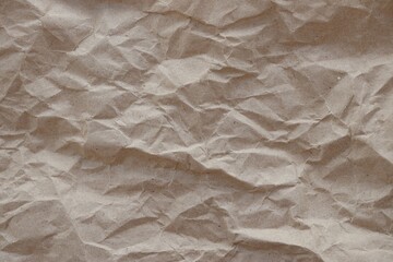 Brown crumpled recycled paper texture background. Kraft Paper