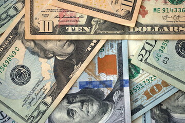 Big amount of different dollar bills close up. Hundred fifty twenty ten and five dollar banknotes