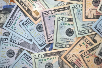 Big amount of different dollar bills close up. Hundred fifty twenty ten and five dollar banknotes
