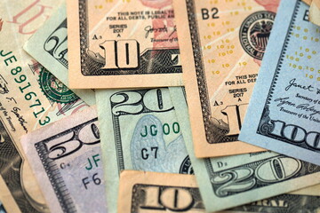 Big amount of different dollar bills close up. Hundred fifty twenty ten and five dollar banknotes