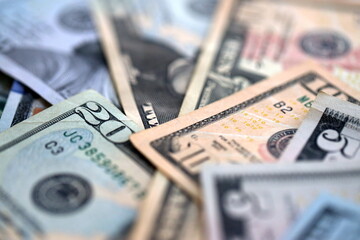 Big amount of different dollar bills close up. Hundred fifty twenty ten and five dollar banknotes