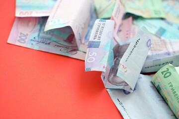 Big amount of Ukrainian hryvnia money bills. Pile of crumpled ukrainian banknotes